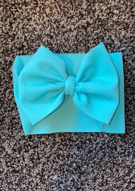 Light teal headwrap, messy bow